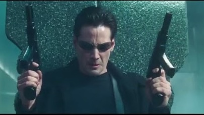 Neo with two pistols in The Matrix
